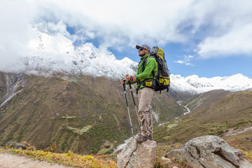 Obraz premium Hiker posing in Himalayas in front of big mountains