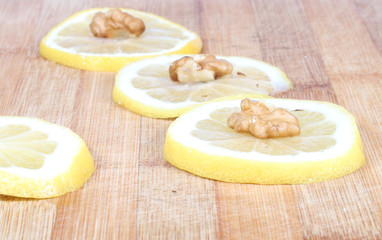 walnuts ,lemons, wooden board