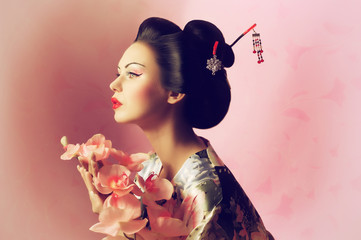 Portrait of a Japanese geisha woman - obrazy, fototapety, plakaty