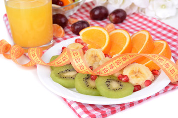 Naklejka na ściany i meble Sweet fresh fruits on plate on table close-up