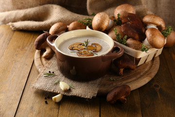 Composition with mushroom soup in pot, fresh and dried