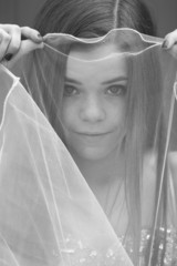 teen girl behind a veil