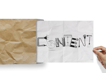 hand pulling crumpled paper from envelope with design word CONTE