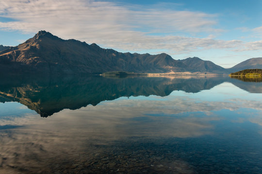 mountains reflecting in lake Wakatipu, New Zealand