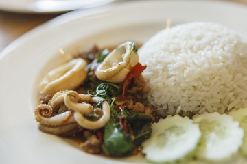Rice topped with stir-fried basil