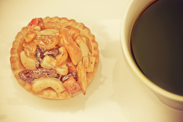 vintage black coffee and Fruit Tart  on wooden table