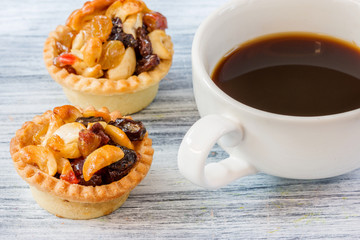Black coffee and Fruit Tart  on wooden table
