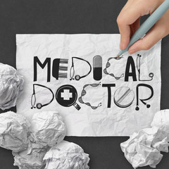 hand drawn design word MEDICAL DOCTOR on crumpled paper with as
