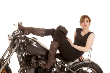 Fototapeta na wymiar Latin woman sit motorcycle serious legs up
