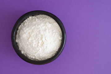 flour in a bowl - studio shot from above - top view and text space