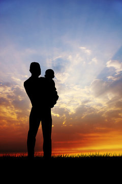 Father and son at sunset