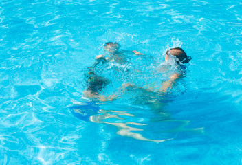 Fototapeta premium Family in the swimming pool.