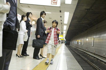 boy walking along platform