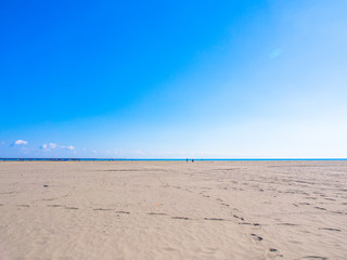 Shining blue sky, sea and sand beach