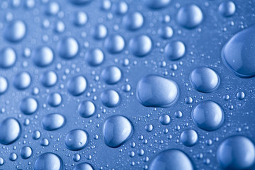 Drops of water on blue background