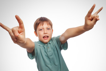 teenager boy shows gesture hands metal rock devil isolated on wh