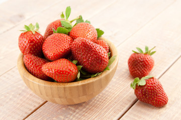 Ripe red strawberries in a bowl