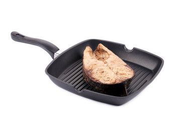 Grilled carp steak on pan.