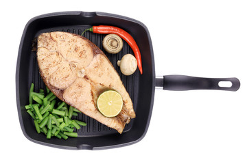 Grilled carp steak on pan.