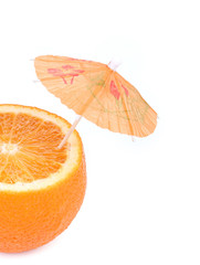 Cut orange under umbrella.