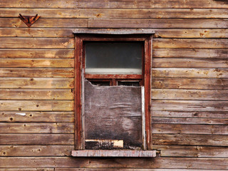 wooden wall with a board up window - obrazy, fototapety, plakaty