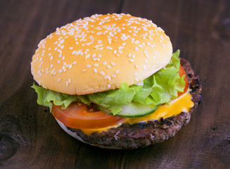Tasty hamburger on a  table
