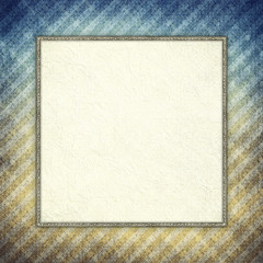 Blank paper sheet in golden frame on grunge patterned background