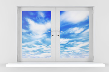 Fototapeta na wymiar Blue sky with clouds seen through window