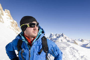 Fototapeta na wymiar Alpinist looking at mountains