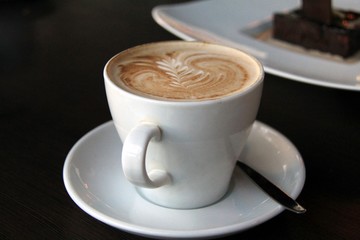 cappuccino cup with drawing on scum
