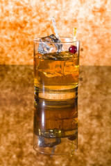 Whisky liqueur glass with ice cubes