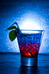 Layered cocktail with blue and red