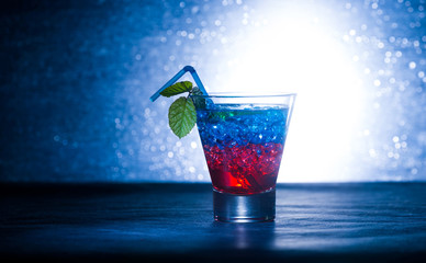 Layered cocktail with blue and red