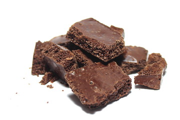 Broken chocolate bar on a white background