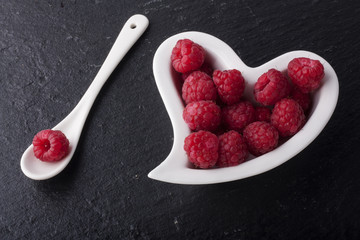Beautiful Raspberries on a heart shape dish
