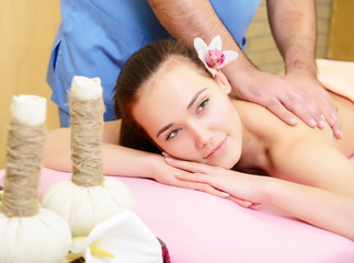 Obraz na płótnie Canvas Beautiful woman enjoy having relaxing massage her back in spa sa