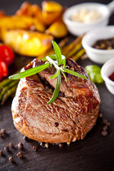 Fresh beef steak on black stone