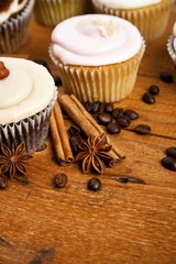 chocolate cupcake, coffee beans, cinnamon, star anise on sacking