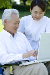 Obraz premium senior man using PC