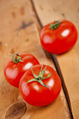 Tomatoes, cooked with herbs for the preservation on the old wood