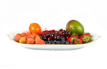 Plate with several fruits over white background