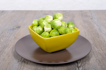 Brussels sprouts in a brown plate