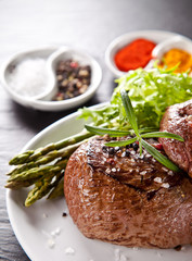Fresh beef steak on black stone