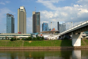 The Vilnius city walking bridge with skyscrapers