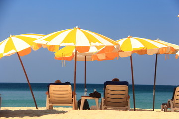 clear blue sky with beach umbrella