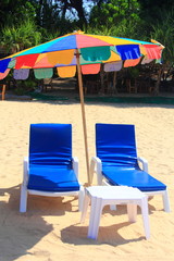 clear blue sky with beach umbrella