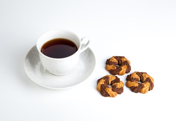 cup of tea with cookies with cacao on a white background