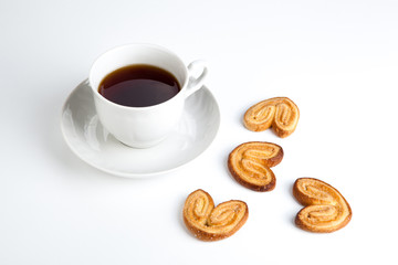 cup of tea with cookies in the shape of hearts 2
