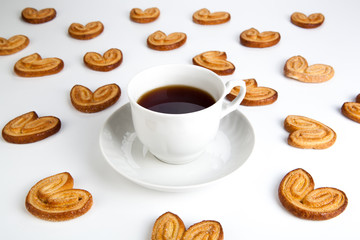 cup of tea with cookies in the shape of hearts 2