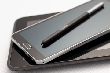 Phablet, tablet with selective focus on a stylus pen